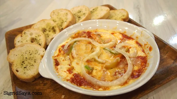 Two pans pizza dip and bread