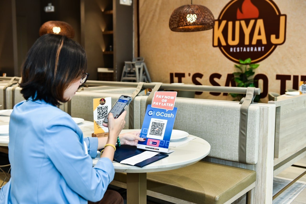 Customer paying at Kuya J Restaurant with GCash scan-to-pay