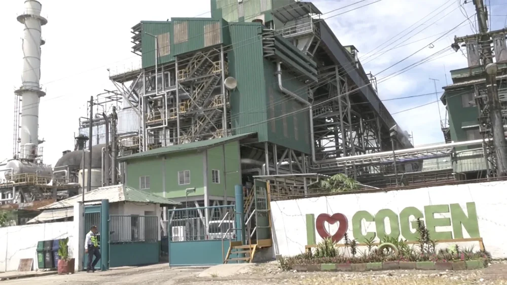 URC SURE’s SONEDCO sugar plant built a biomass-fired cogeneration plant that now provides 19 megawatts to the national grid using bagasse, a byproduct of sugar milling, as fuel. SONEDCO, sugar industry, sugar mill, Negros Occidental, sugar, refined sugar, Bacolod City, URC president and CEO Irwin Lee, URC chairman Lance Gokongwei, Kabankalan, Kabankalan sugar mill, Universal Robina Corporation, Southern Negros Development Corp.