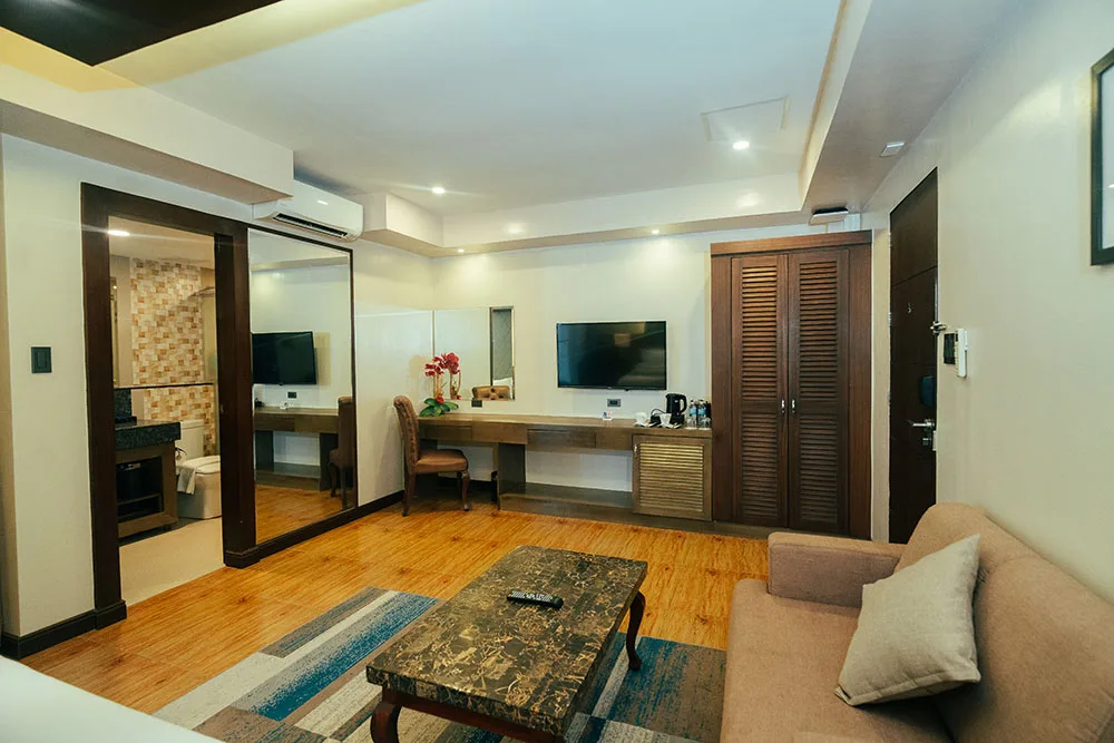 The living room of the Deluxe room with a beach view.