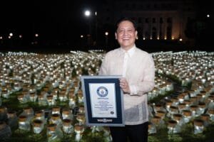 Benedict Sison, CEO Country Head of Sun Life Philippines, holding the official certificate from the Guinness World Records.
